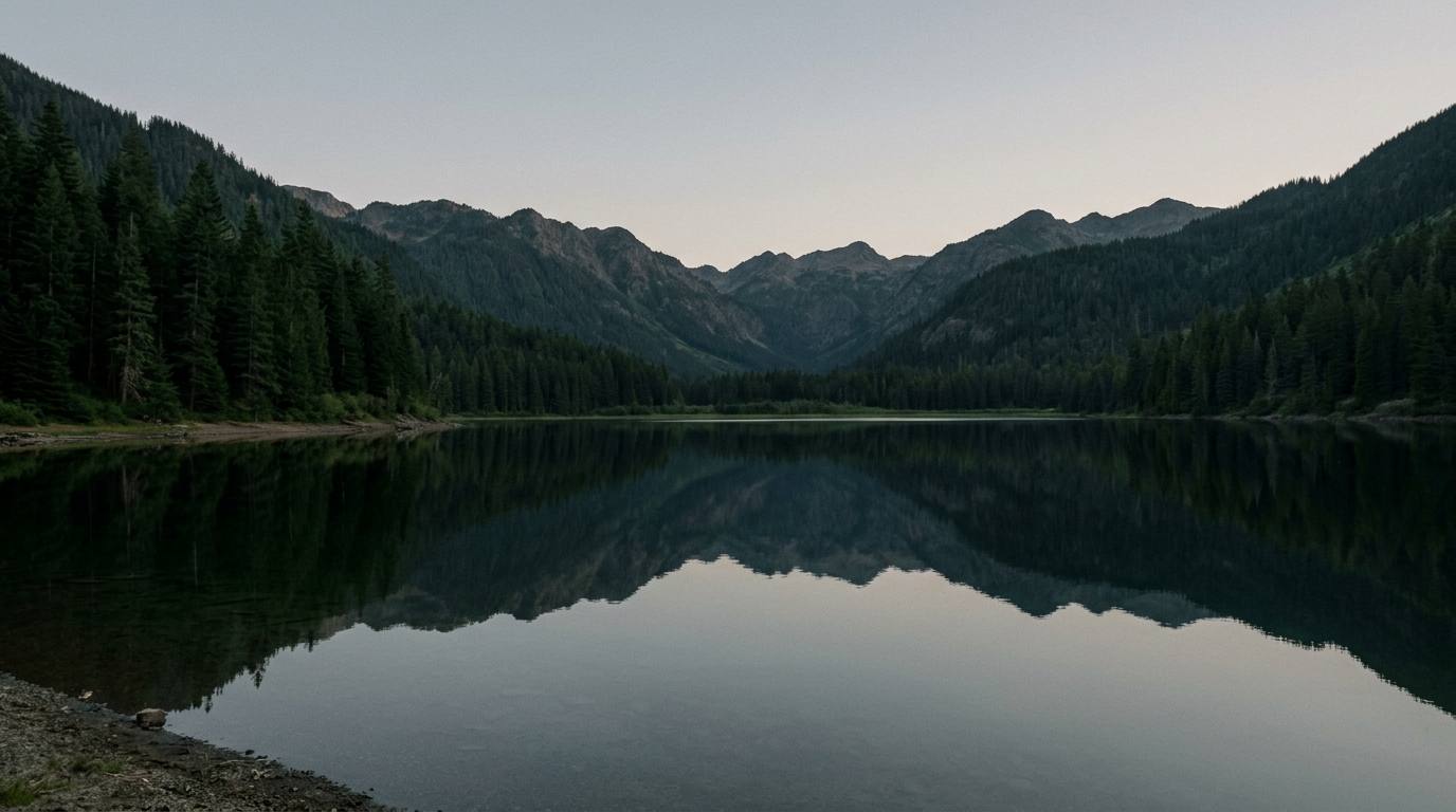 Still alpine lake at dusk